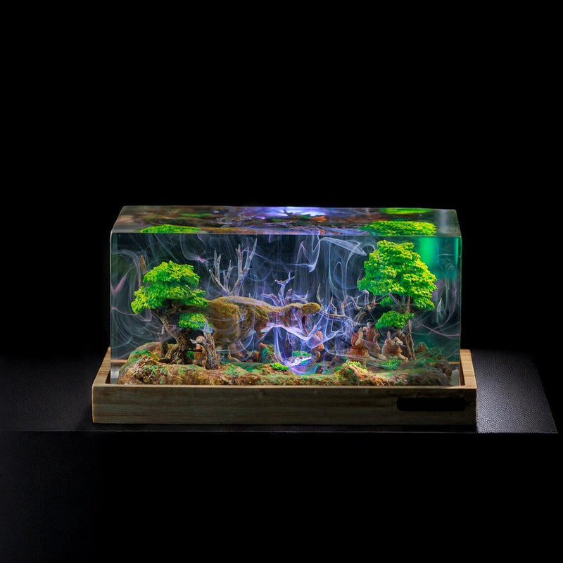 Dinosaur resin lamp with a T-Rex and cave hunters in a forest diorama