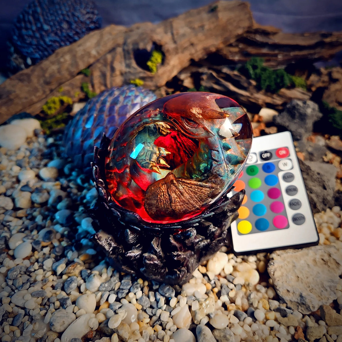 Bronze baby dragon egg lamp glowing red with remote