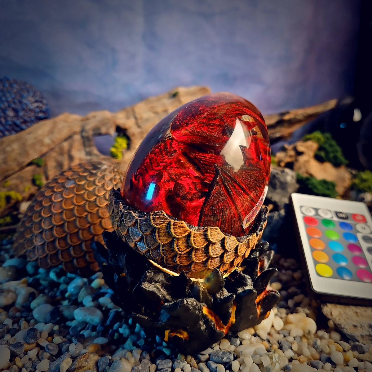 Dragon egg resin lamp with a crimson dragon glowing red on a lava base