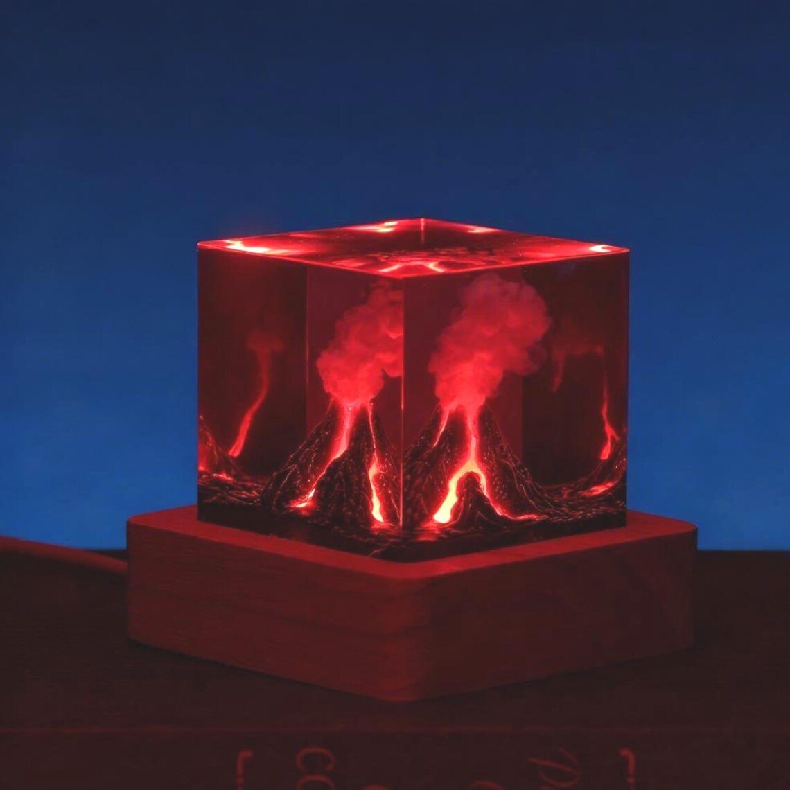 Volcano resin cube glowing red at night