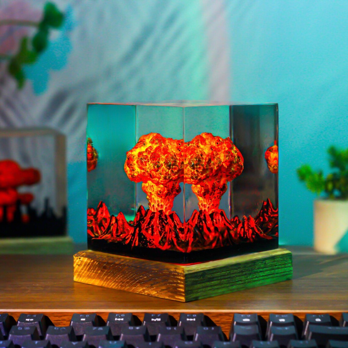 Fiery eruption volcano resin lamp beside a keyboard