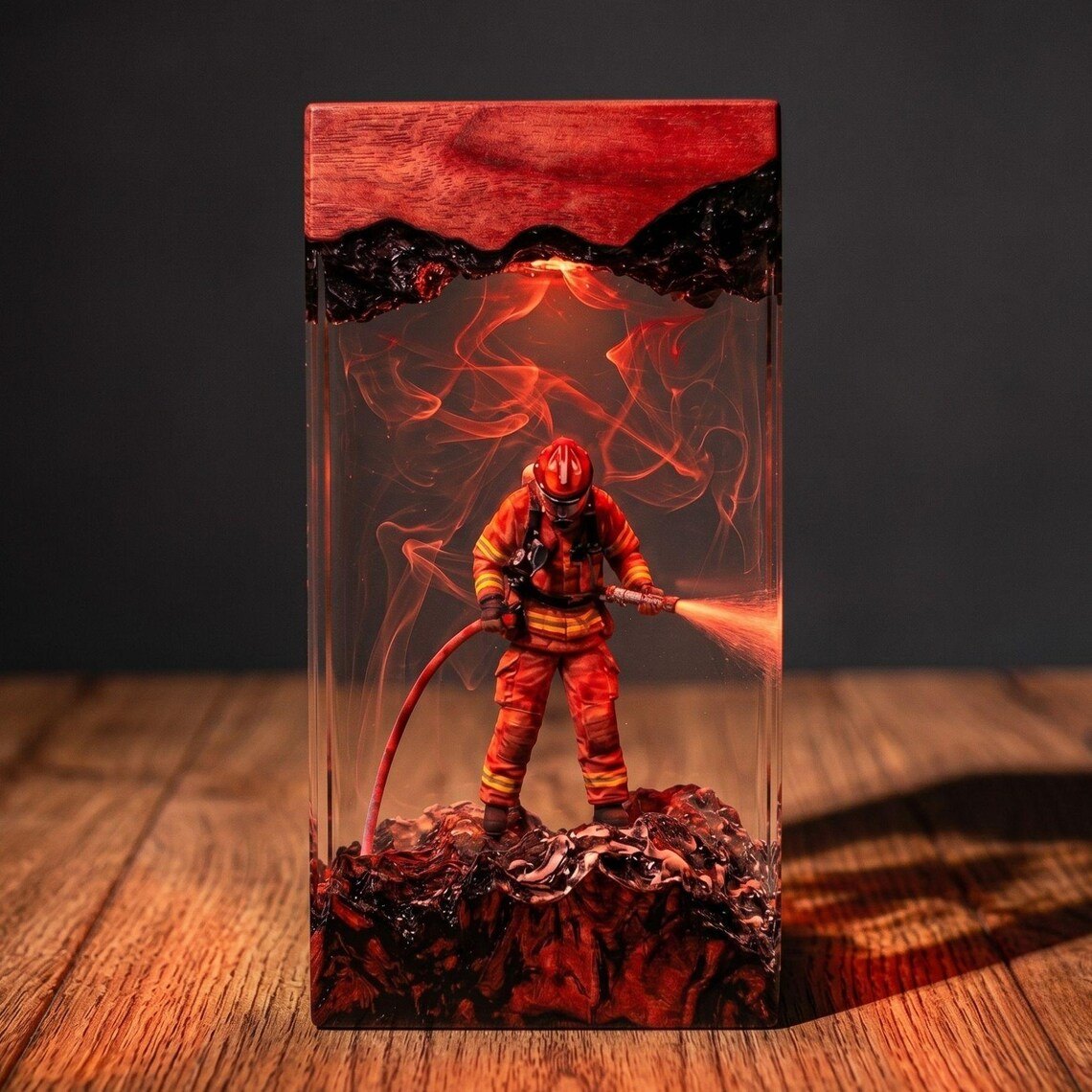 Firefighter resin lamp with red smoke on a wood surface