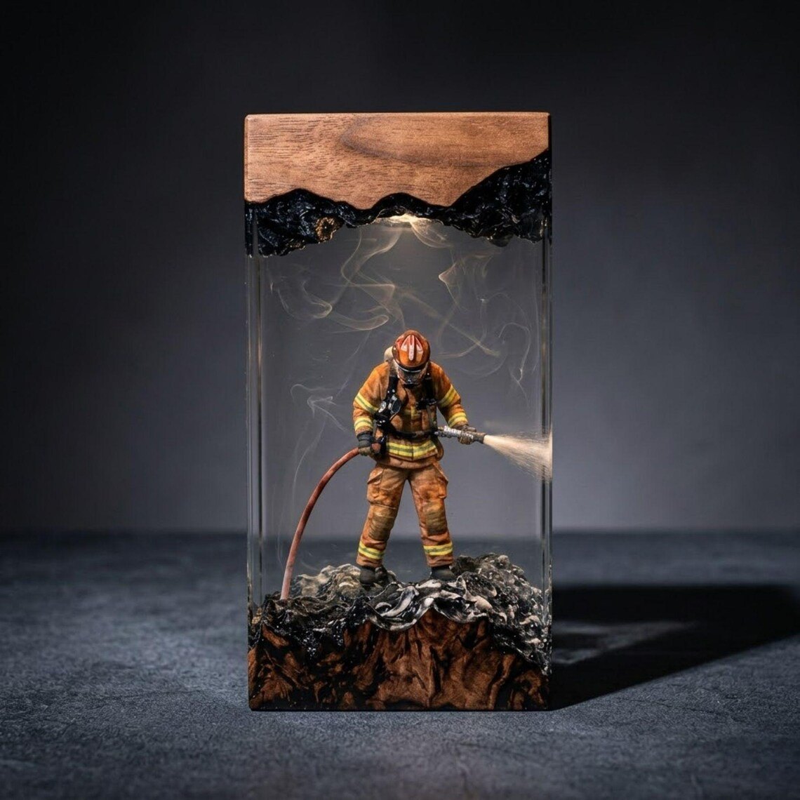 Firefighter resin lamp with natural wood top and soft white glow
