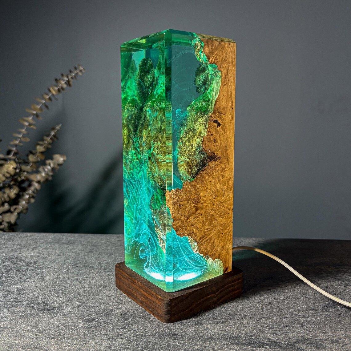 Moss resin lamp with burl wood side and teal light