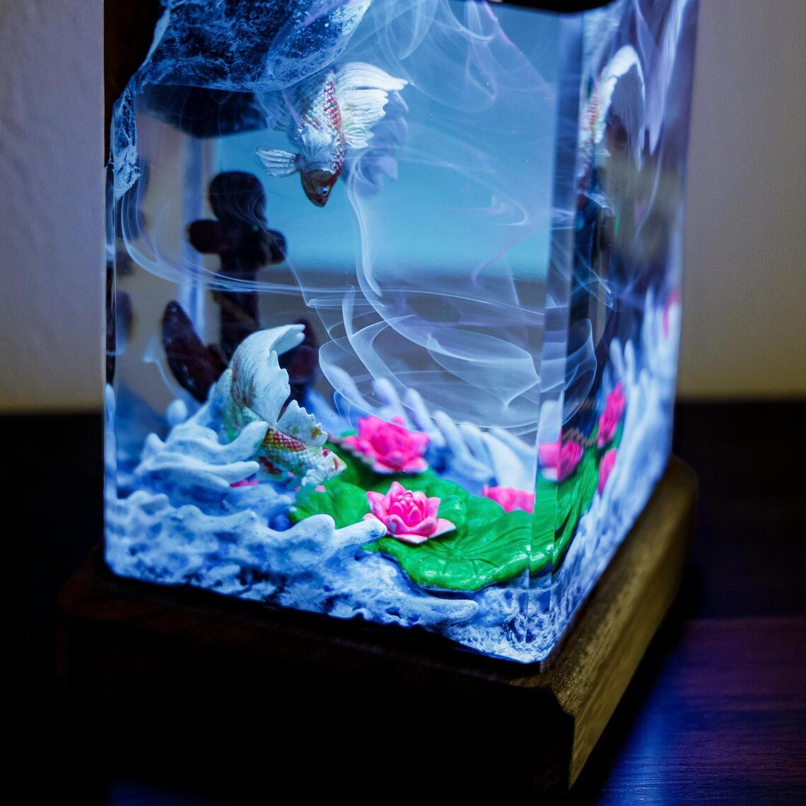 Close-up of koi, lotus and white waves in the resin