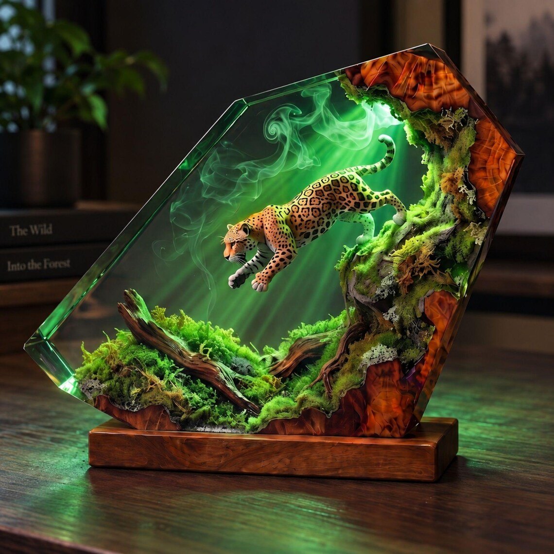 Leaping jaguar resin lamp glowing green on a wooden desk