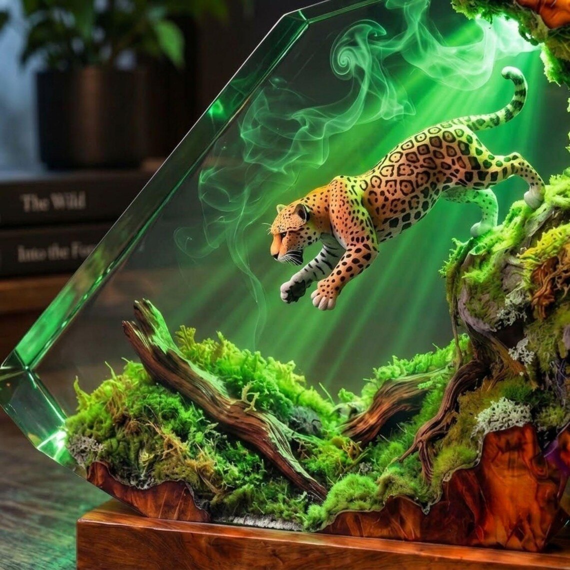 Close view of the leaping jaguar above green moss