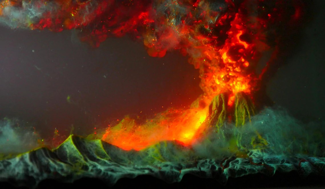 Close-up of erupting volcano and lava flow in resin