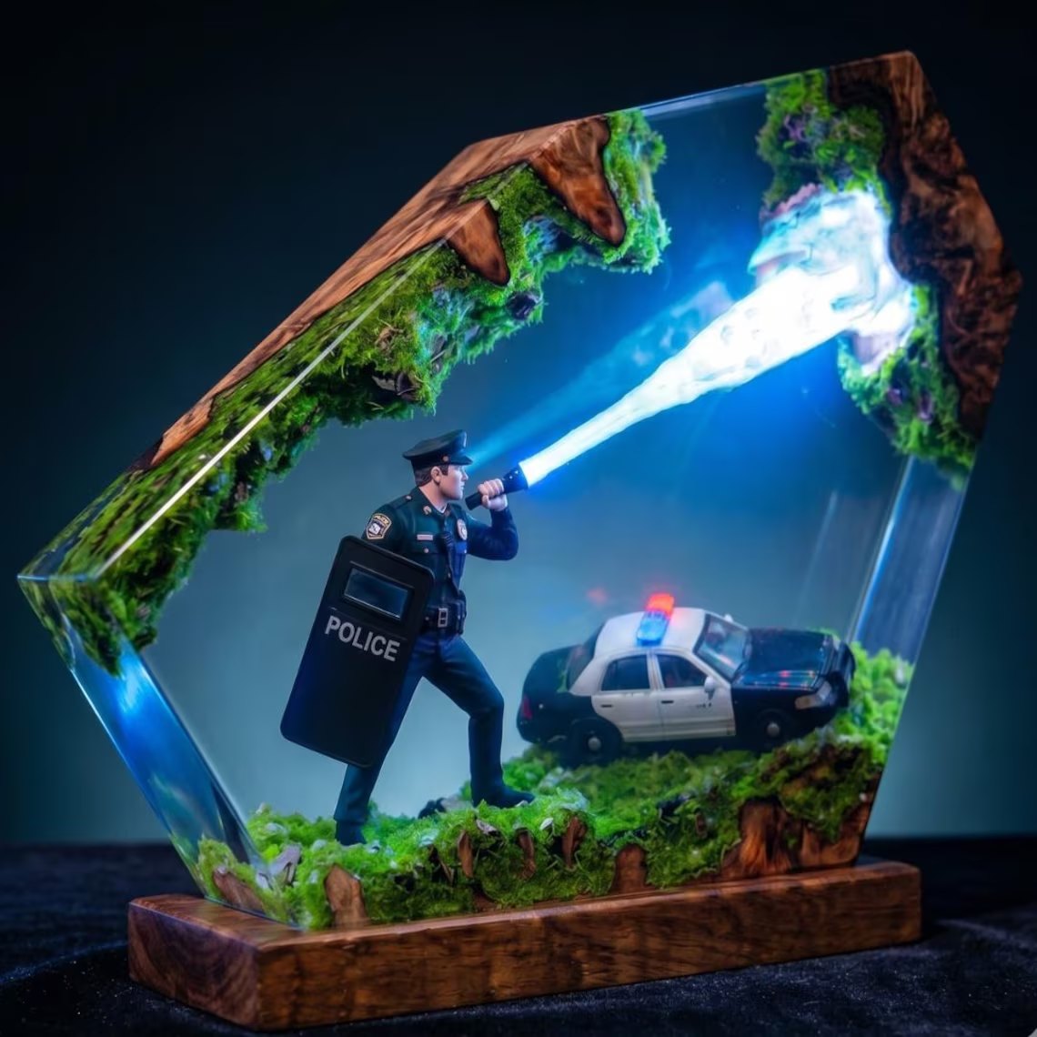 Police resin lamp angled view, blue flashlight beam and patrol car