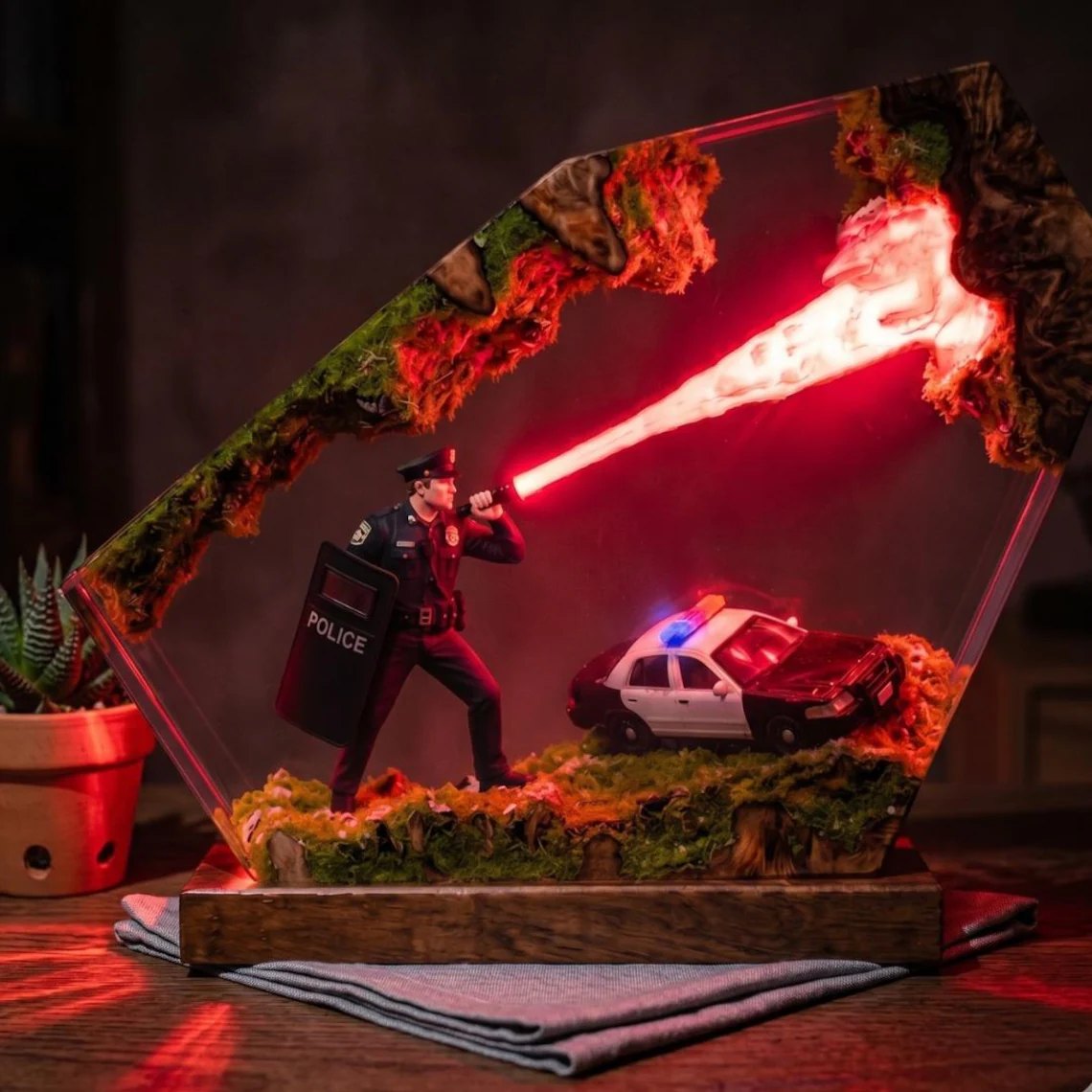 Police resin lamp glowing red, moss textures around the scene
