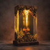 Resin layers flowing around a dragon diorama as the lamp is formed