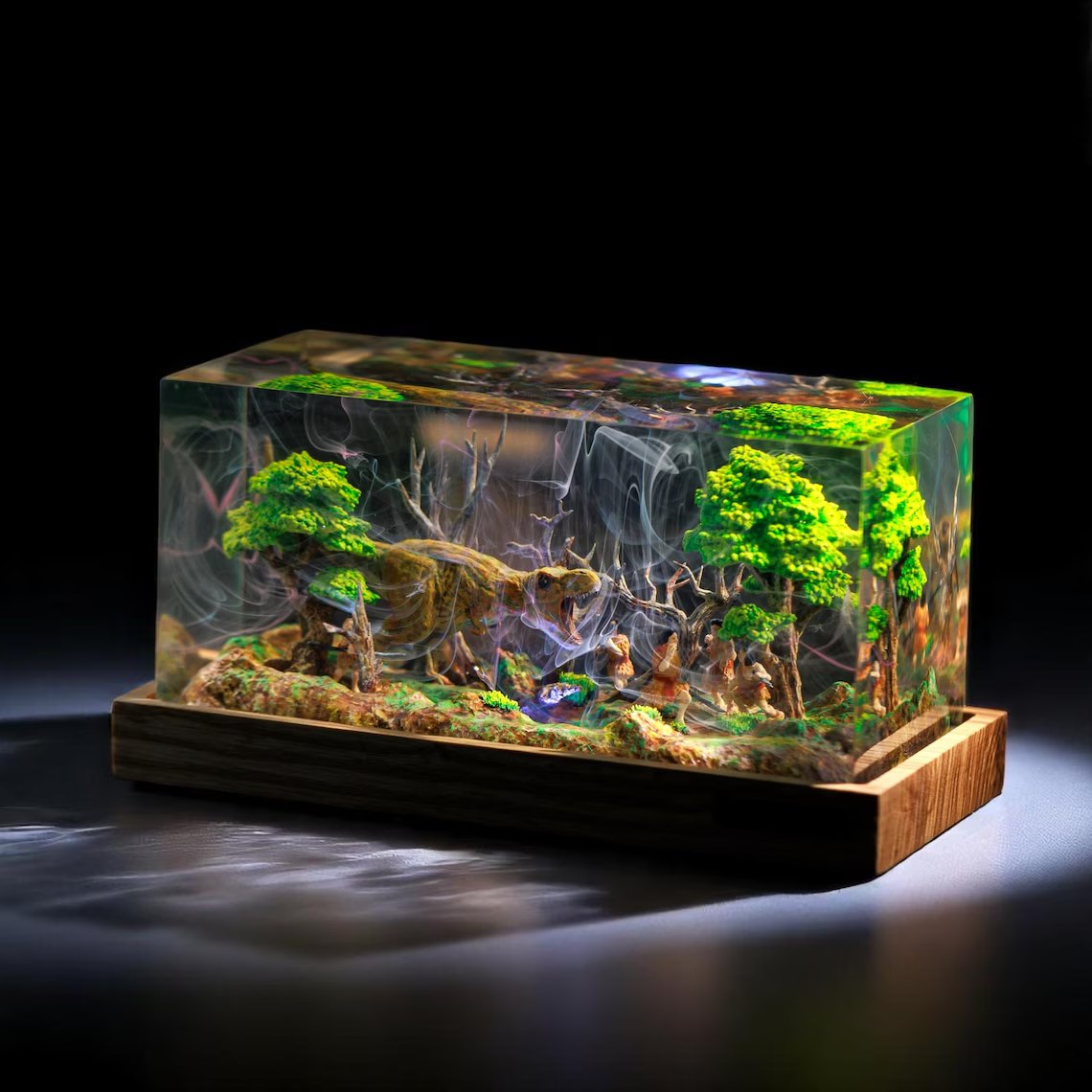 Angled view of the T-Rex and cave hunters resin lamp