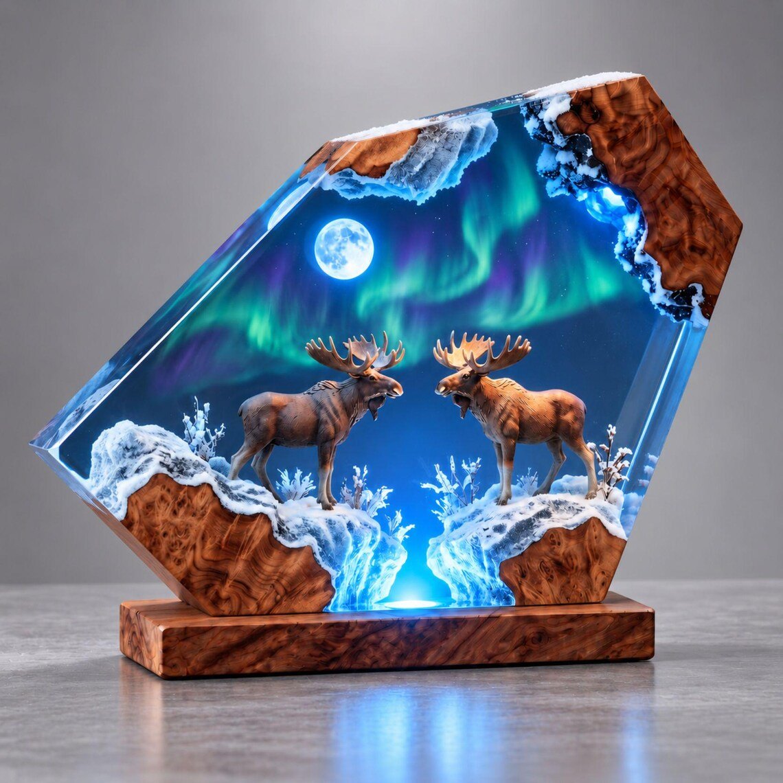 Two moose under northern lights resin lamp glowing blue