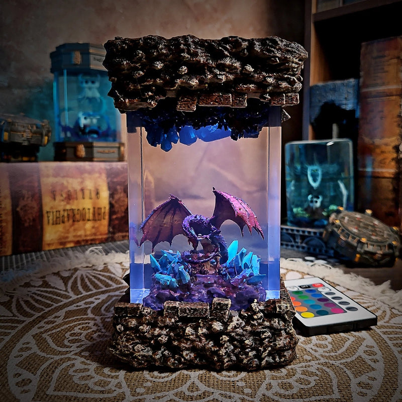 Dragon resin lamp with a winged dragon on crystals glowing lavender